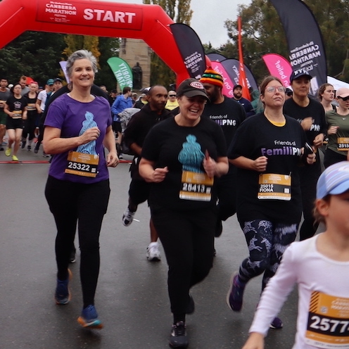 Six #RunforFemiliPNG team members (Clare, Fiona, Fiona, Kingtau, David and Lauren) crossing the start line at the 2023 Canberra Times Marathon Festival.