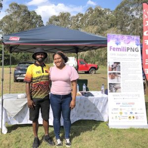 Lesley Wengembo and Mehere Maladina volunteering at the PNGFQI Femili PNG stall